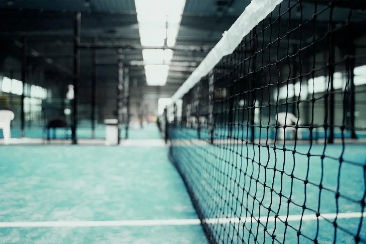 Empty blurry paddle tennis field