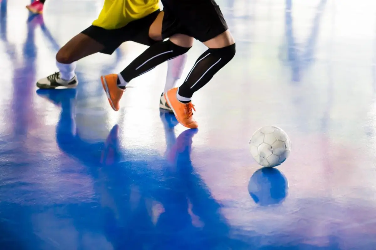 Low section people playing football court (1)